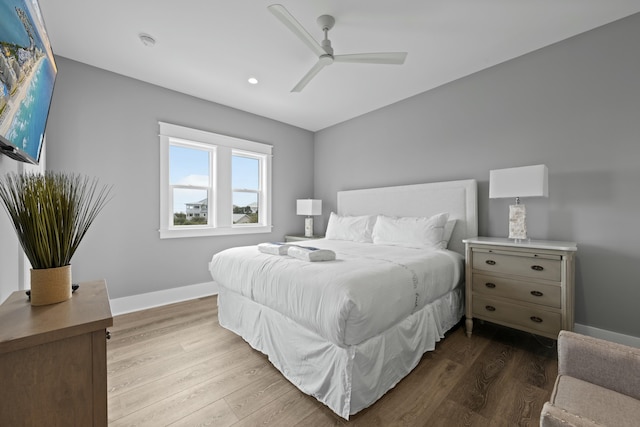 bedroom with wood-type flooring and ceiling fan