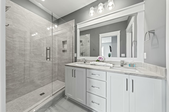 bathroom with vanity and a shower with shower door