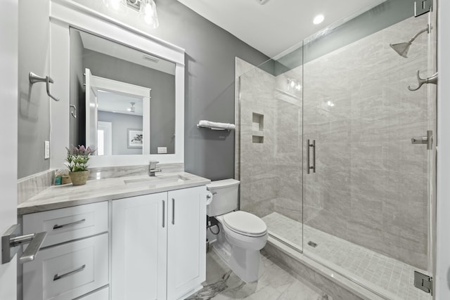 bathroom with vanity, toilet, and walk in shower