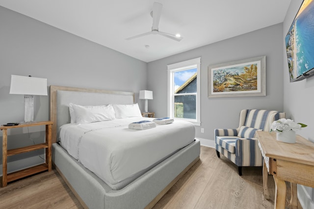 bedroom with ceiling fan and wood-type flooring