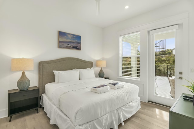 bedroom with access to outside and light wood-type flooring