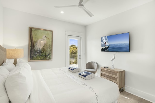 bedroom featuring hardwood / wood-style flooring, access to outside, and ceiling fan