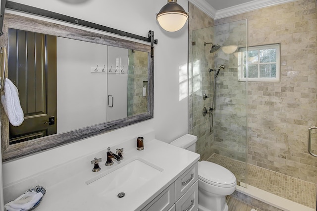 full bath with toilet, a stall shower, ornamental molding, and vanity