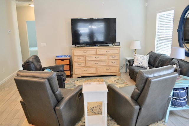 living room with light hardwood / wood-style flooring