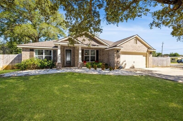 view of front of house with a front yard and a garage