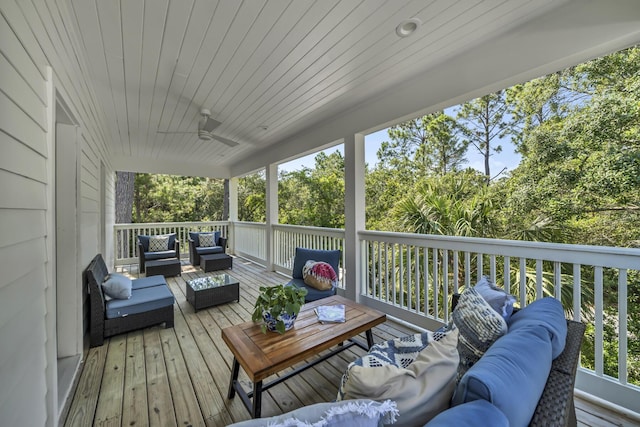 wooden deck featuring ceiling fan and outdoor lounge area