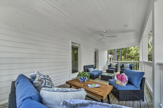 wooden terrace featuring ceiling fan and an outdoor hangout area