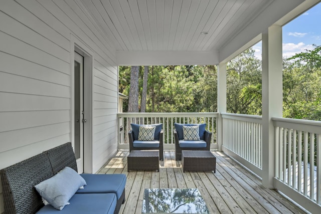 wooden terrace with outdoor lounge area