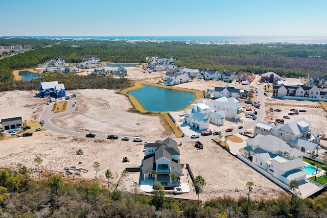 bird's eye view with a water view and a residential view