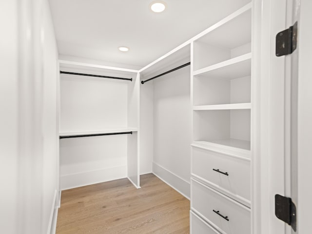 147 Quail Hollow Ct, Watersound, FL 32461 - walk in closet featuring light wood-type flooring