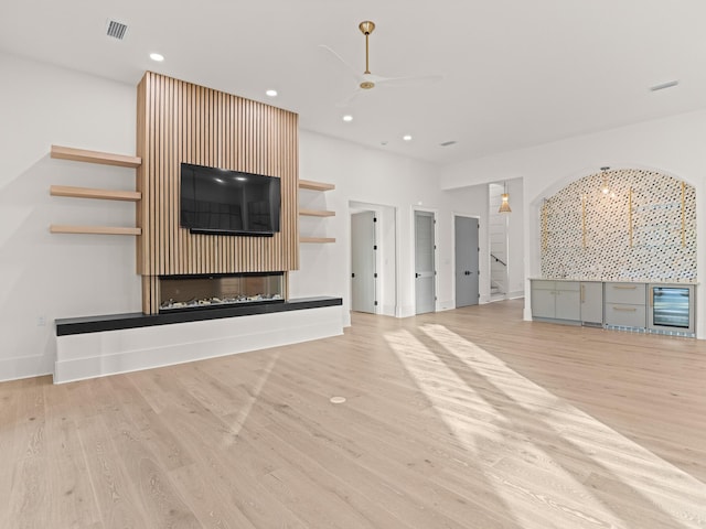 147 Quail Hollow Ct, Watersound, FL 32461 - unfurnished living room featuring wood finished floors, stairway, a ceiling fan, recessed lighting, and baseboards