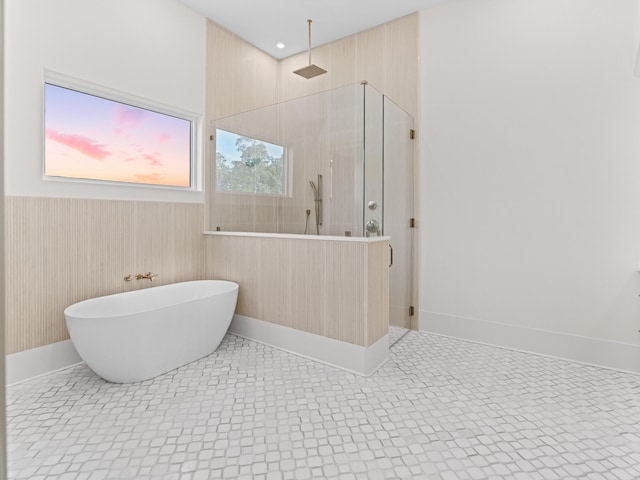 147 Quail Hollow Ct, Watersound, FL 32461 - full bath with a walk in shower, a freestanding tub, and wainscoting