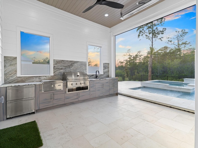 147 Quail Hollow Ct, Watersound, FL 32461 - view of patio / terrace with area for grilling, exterior kitchen, ceiling fan, an in-ground hot tub, and a sink