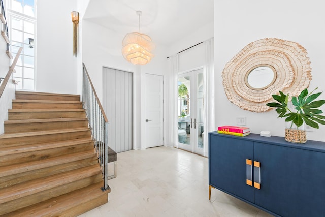 entrance foyer with french doors and stairway