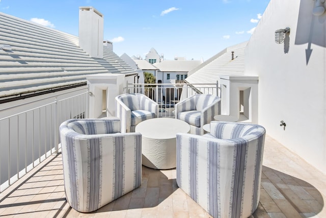 view of patio featuring a balcony