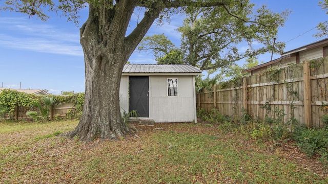 view of outdoor structure with a lawn