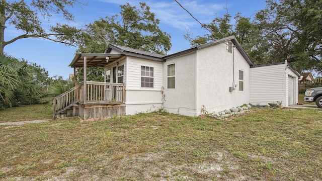 view of home's exterior featuring a lawn