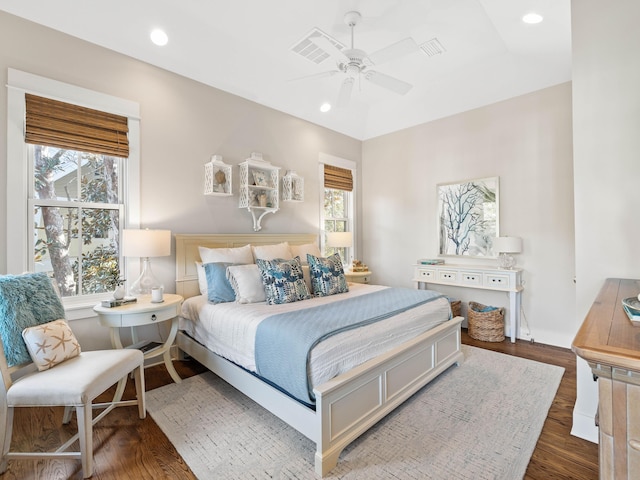 bedroom featuring ceiling fan, dark wood-style flooring, visible vents, and recessed lighting