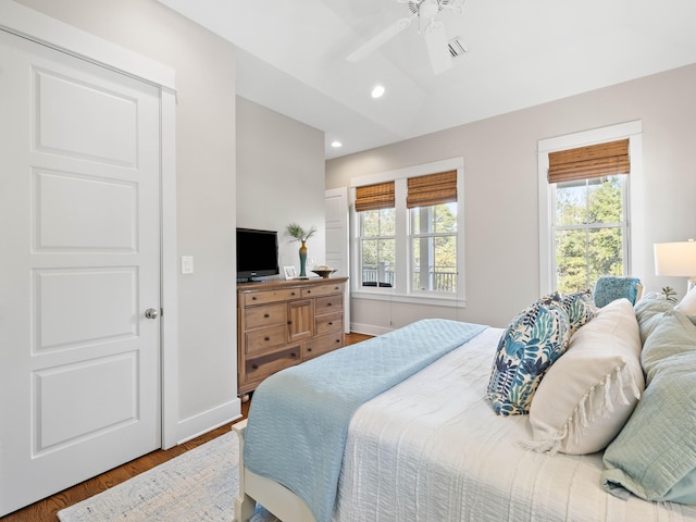 bedroom featuring recessed lighting, ceiling fan, baseboards, and wood finished floors