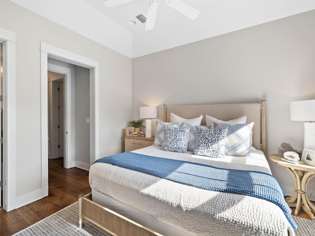 bedroom with ceiling fan, dark wood-type flooring, visible vents, and baseboards