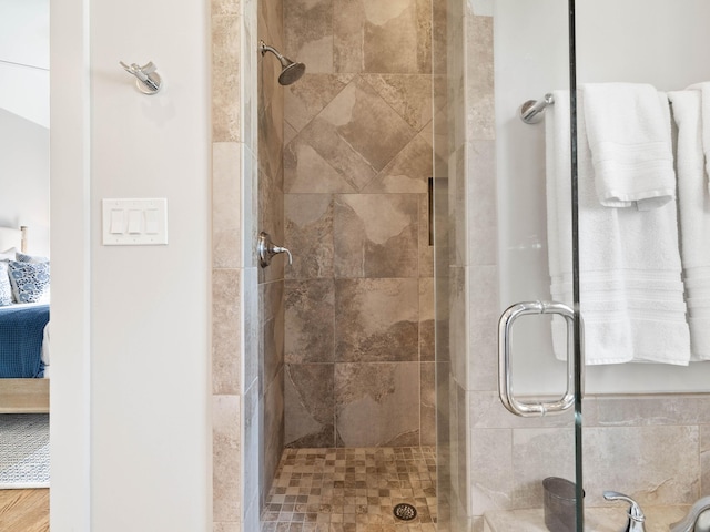 ensuite bathroom featuring ensuite bath and tiled shower