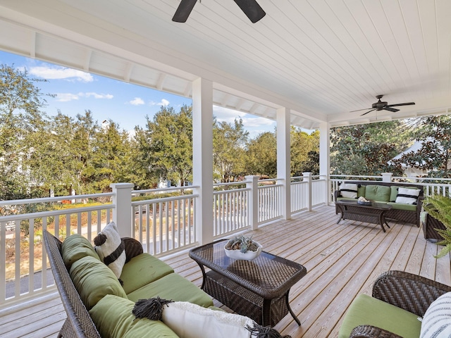 deck featuring outdoor lounge area and a ceiling fan