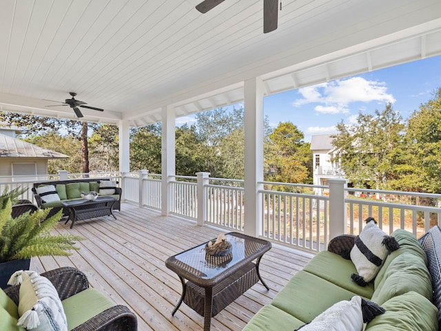 wooden terrace featuring a ceiling fan and an outdoor hangout area