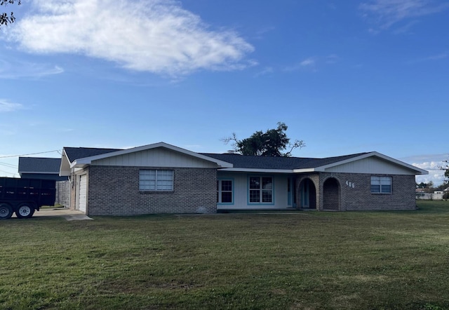 ranch-style house with a garage and a front yard