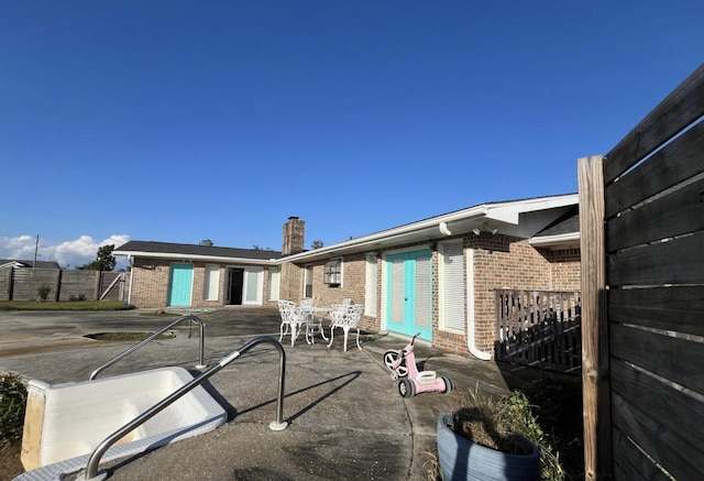 back of property with a patio area