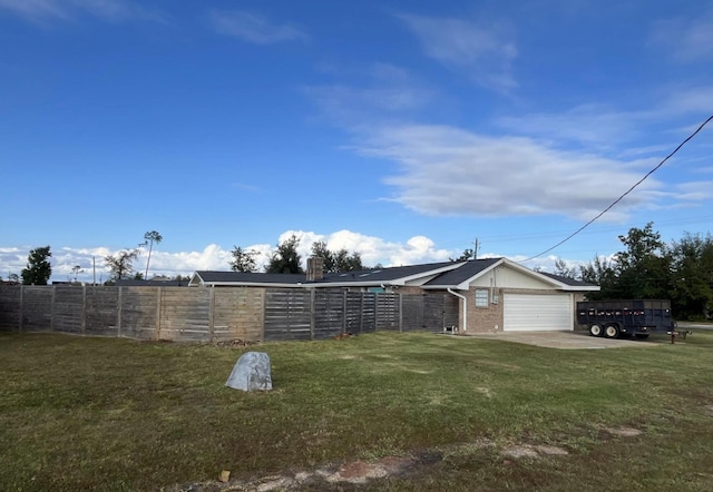 view of yard with a garage