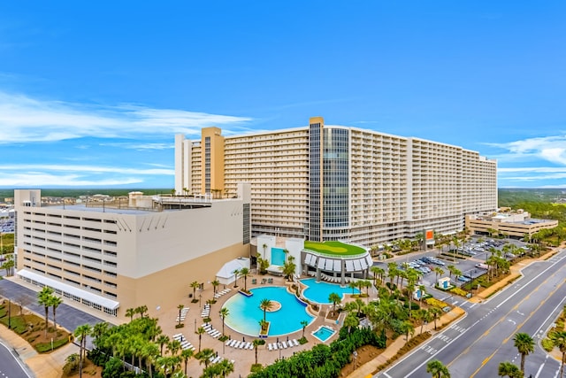 9860 S Thomas Dr Unit 921, Panama City Beach, FL 32408 - view of building exterior featuring a community pool