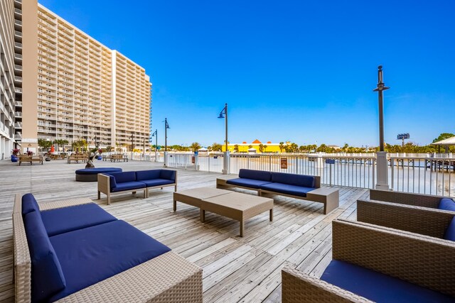 9860 S Thomas Dr Unit 921, Panama City Beach, FL 32408 - wooden deck with an outdoor hangout area and a water view