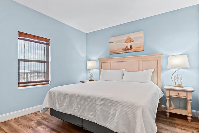 9860 S Thomas Dr Unit 921, Panama City Beach, FL 32408 - bedroom featuring wood finished floors and baseboards
