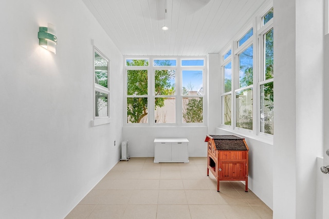 sunroom featuring radiator heating unit