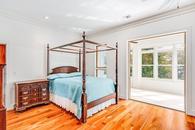 bedroom with recessed lighting, visible vents, and wood finished floors