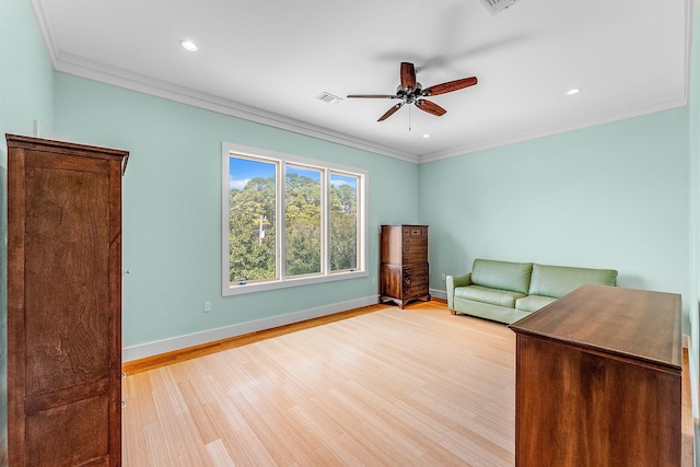 interior space with crown molding, recessed lighting, light wood-style flooring, a ceiling fan, and baseboards