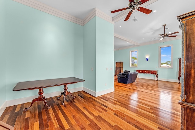 unfurnished room featuring recessed lighting, wood finished floors, visible vents, baseboards, and crown molding