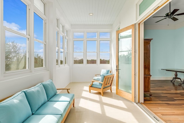 sunroom featuring a ceiling fan