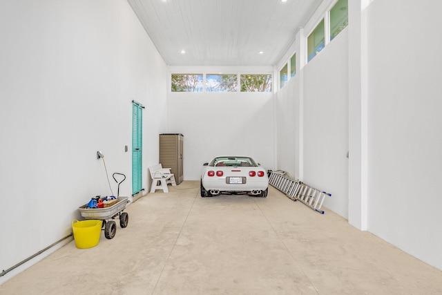 interior space featuring concrete flooring and recessed lighting