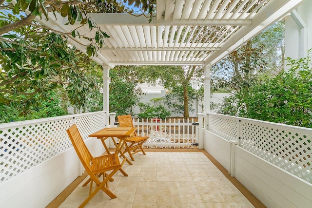 balcony featuring a pergola