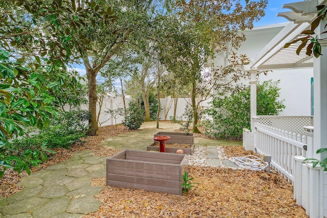 view of yard featuring a patio area and a fenced backyard