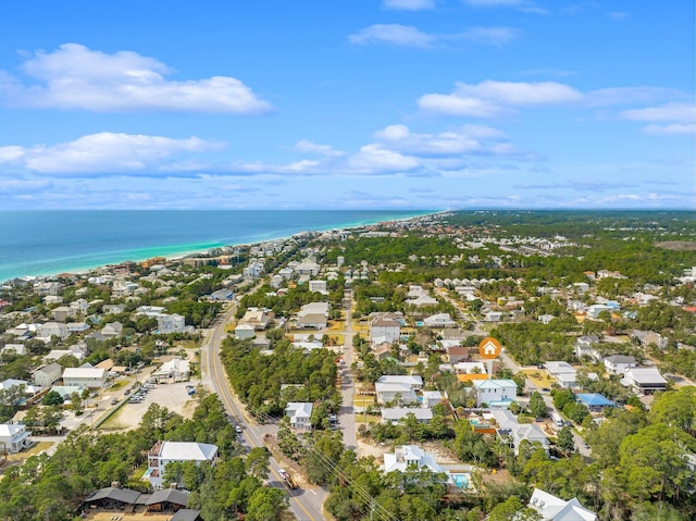 birds eye view of property with a water view, a residential view, and a view of the beach