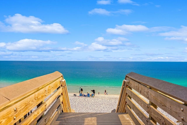 view of property's community featuring a view of the beach and a water view