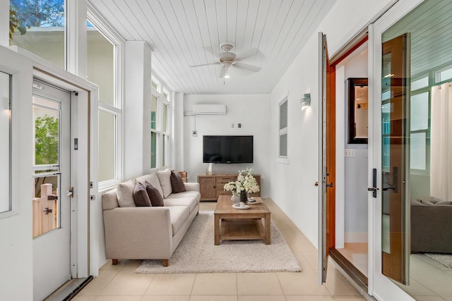 sunroom / solarium featuring a wall unit AC, wood ceiling, and a ceiling fan