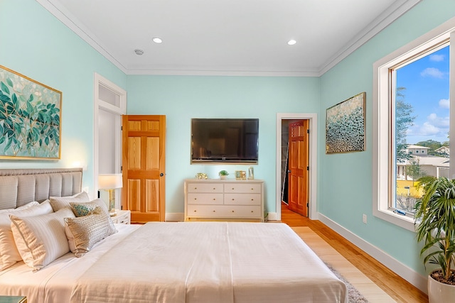 bedroom featuring baseboards, ornamental molding, recessed lighting, and light wood-style floors