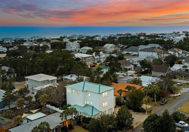 bird's eye view featuring a water view and a residential view