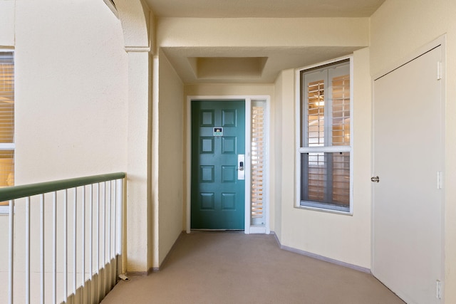 property entrance with stucco siding