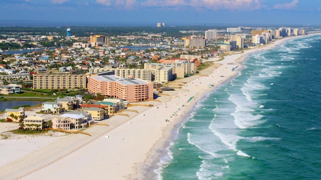 aerial view with a city view, a beach view, and a water view