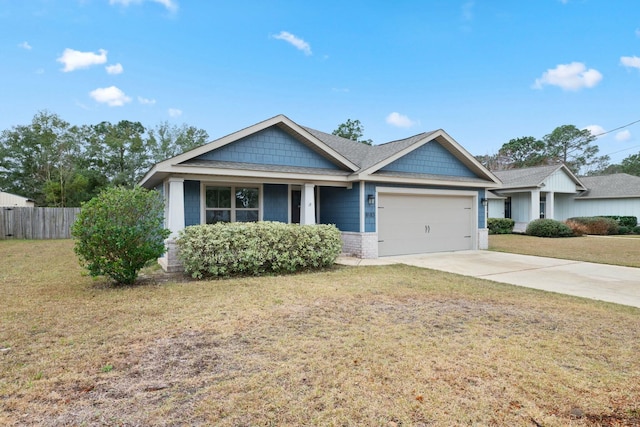 view of front of home featuring a garage and a front lawn