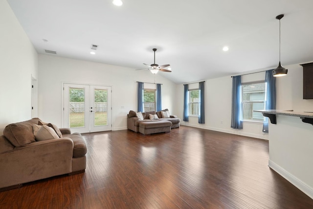 living room with vaulted ceiling, ceiling fan, dark hardwood / wood-style flooring, and french doors